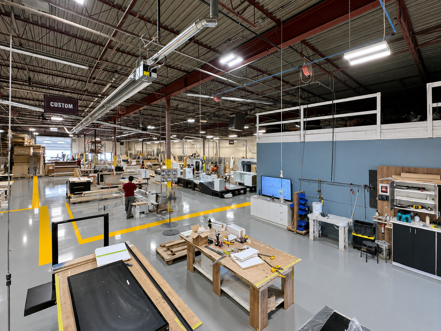 Inside the Sandha Woodworks Ontario millwork facility — production floor with custom millwork stations, CNC preparation, and assembly benches